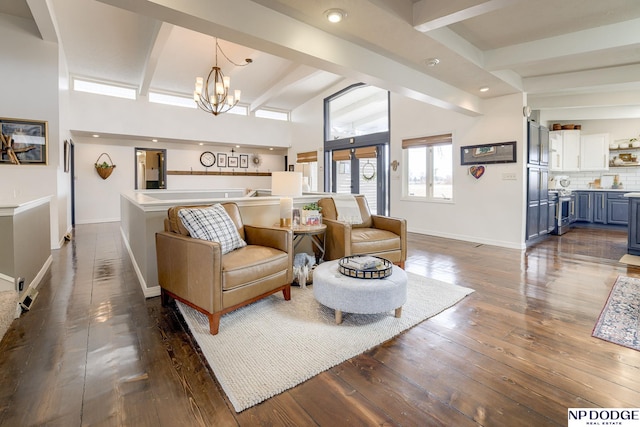 living area with beam ceiling, recessed lighting, baseboards, a chandelier, and dark wood-style flooring