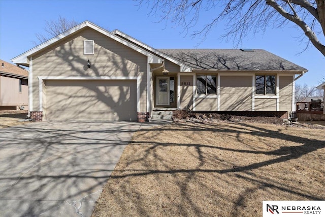 view of front of house with an attached garage and concrete driveway