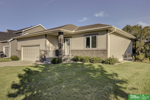 prairie-style home featuring stone siding, a garage, concrete driveway, and a front lawn