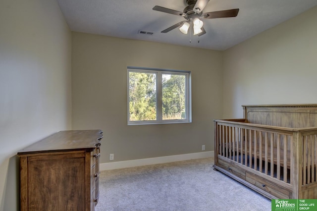 bedroom featuring a ceiling fan, baseboards, visible vents, and carpet floors