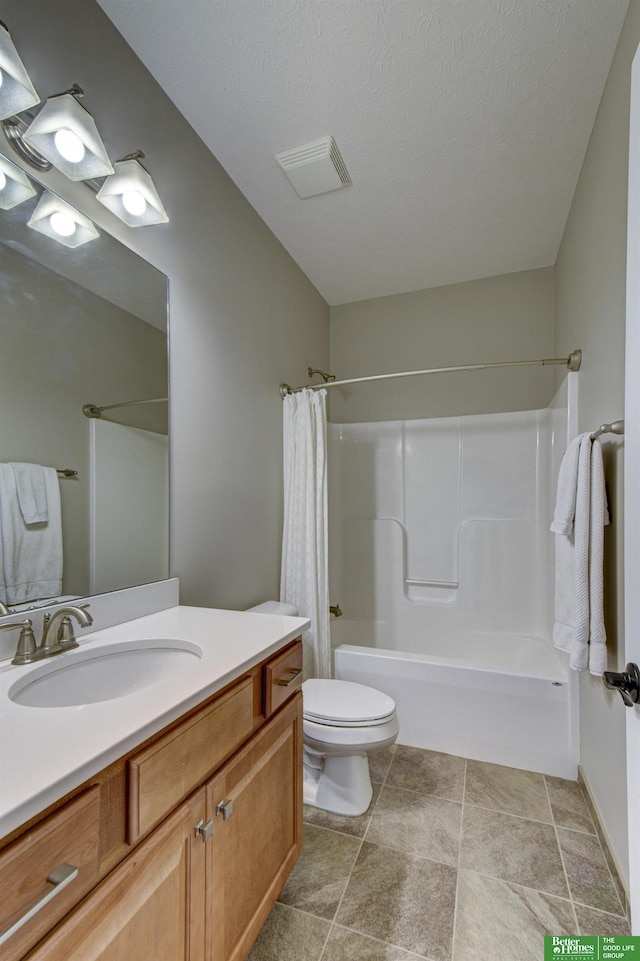 bathroom featuring visible vents, toilet, vanity, shower / bath combination with curtain, and a textured ceiling