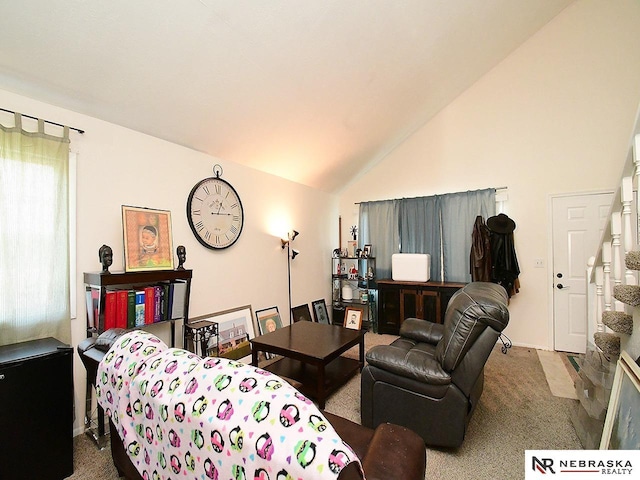 living room featuring carpet floors and vaulted ceiling