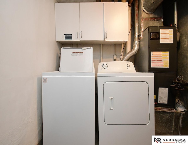 laundry room with cabinet space and washer and dryer