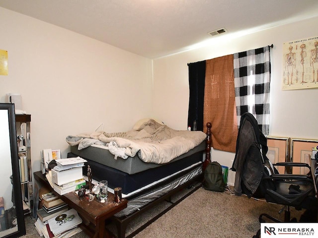 bedroom featuring carpet flooring and visible vents