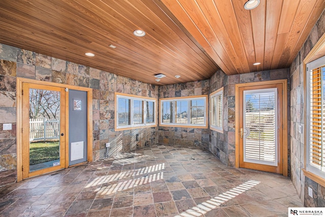 unfurnished sunroom with wood ceiling