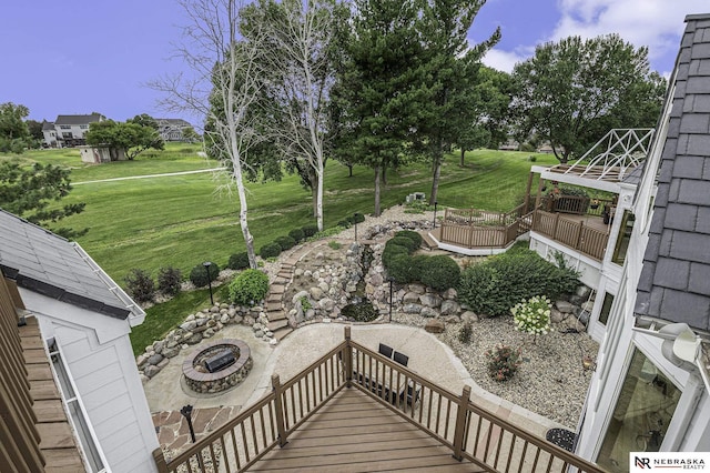 view of yard featuring a patio and a fire pit