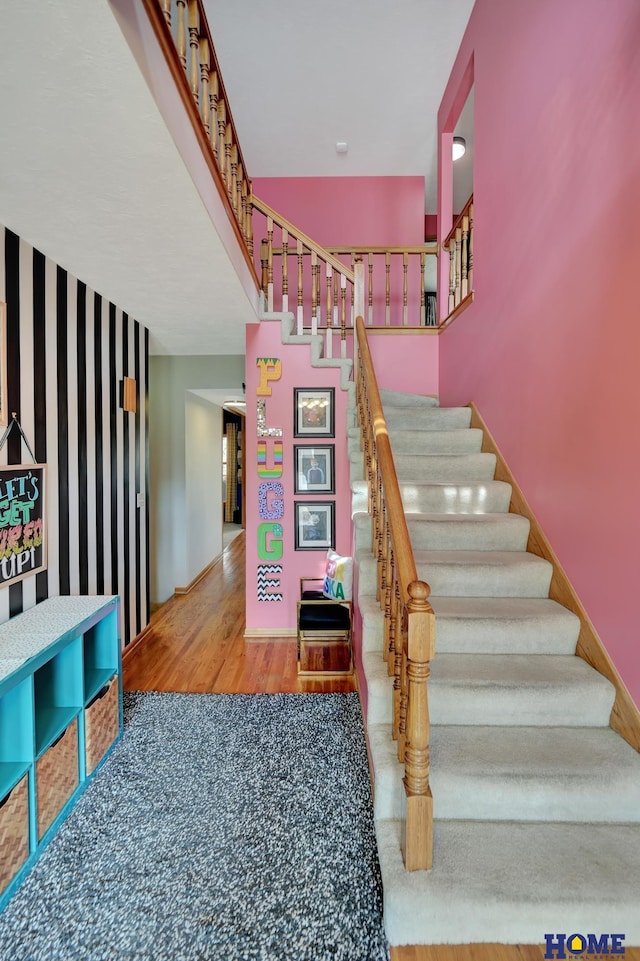 staircase with wood finished floors