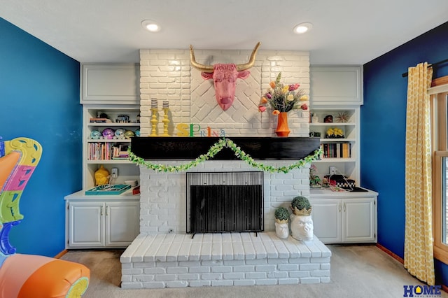 living area with recessed lighting, carpet floors, and built in shelves