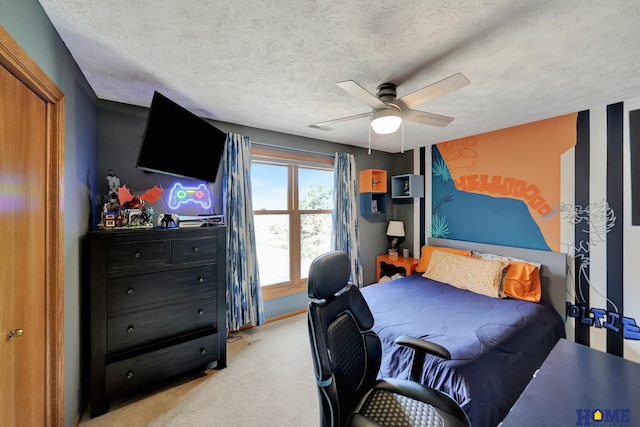 bedroom with a textured ceiling, carpet, baseboards, and ceiling fan