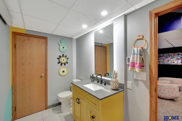 ensuite bathroom with vanity, recessed lighting, a paneled ceiling, ensuite bathroom, and toilet