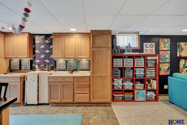 kitchen featuring a drop ceiling and light countertops