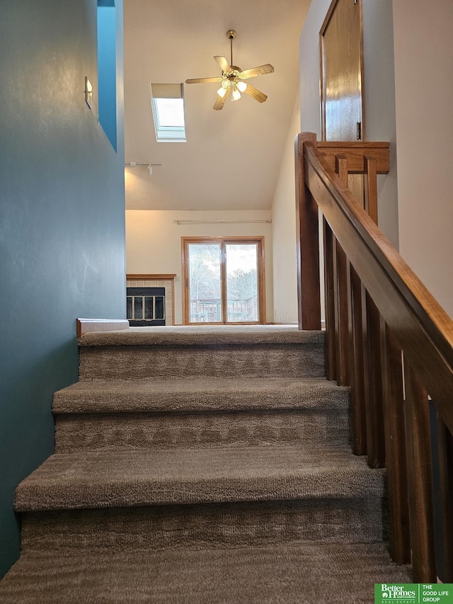 stairs with a ceiling fan