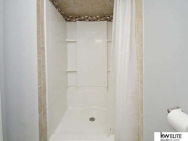 bathroom featuring a shower stall