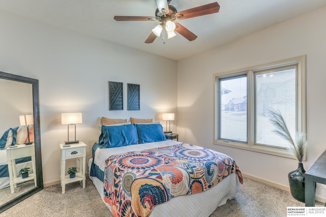 bedroom with a ceiling fan and baseboards