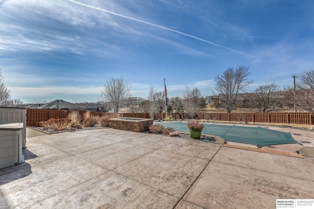 exterior space with a patio area, a fenced in pool, and a fenced backyard