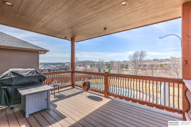 wooden terrace featuring grilling area