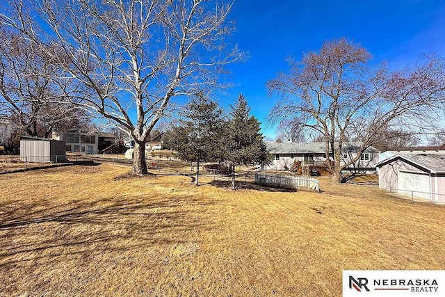 view of yard featuring fence