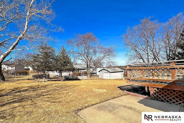 view of yard featuring a wooden deck