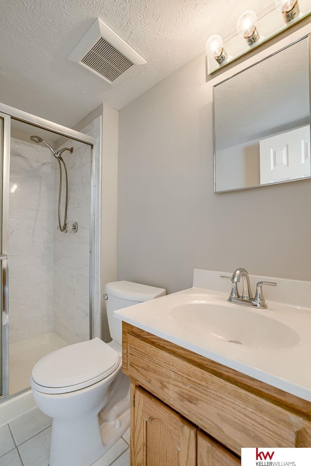 full bath featuring tile patterned flooring, a shower stall, toilet, and visible vents