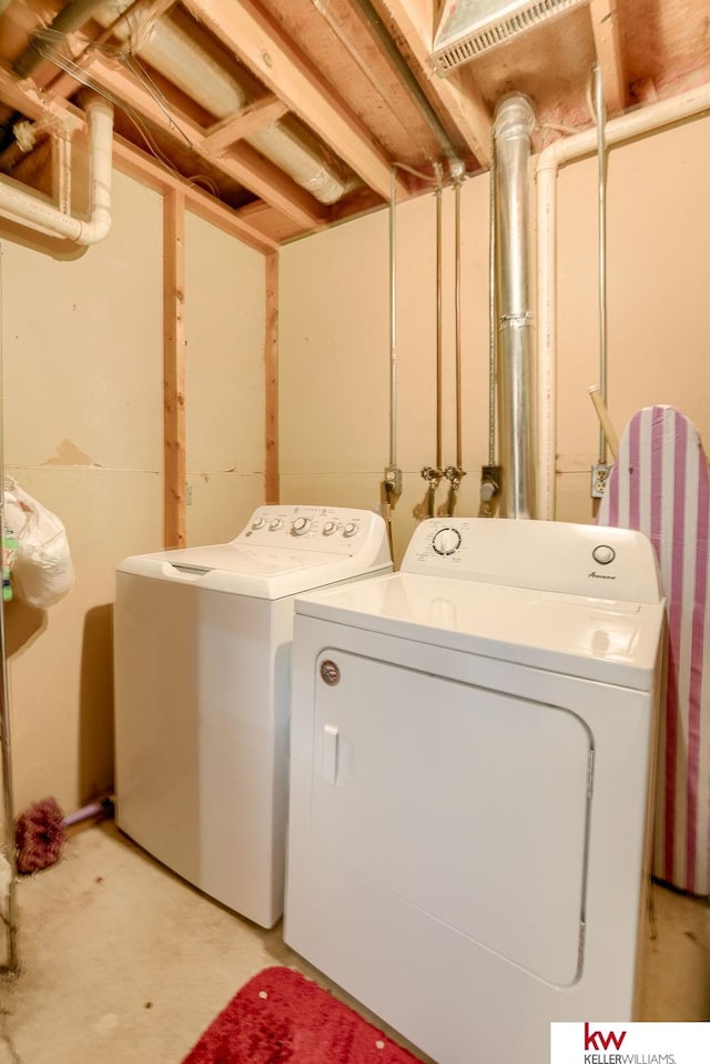 washroom featuring laundry area and washer and dryer