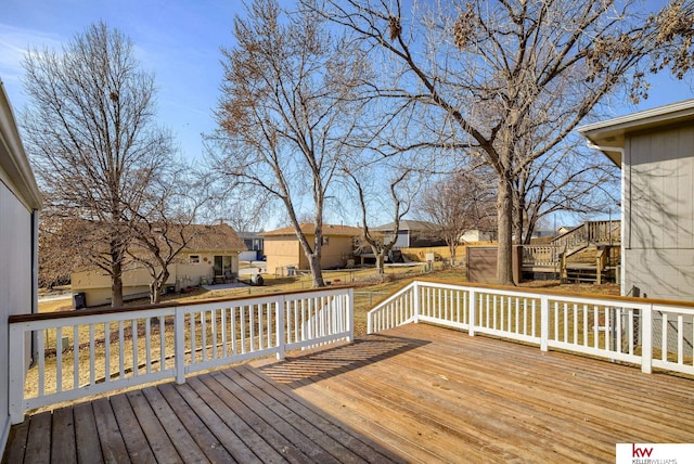 wooden deck with a residential view