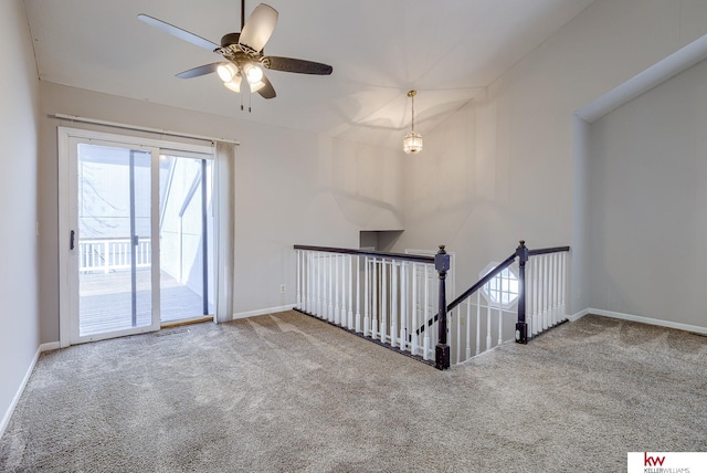 carpeted empty room with visible vents and baseboards