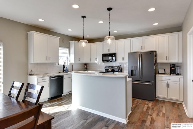 kitchen featuring fridge with ice dispenser, stainless steel electric range, black microwave, light countertops, and dishwashing machine