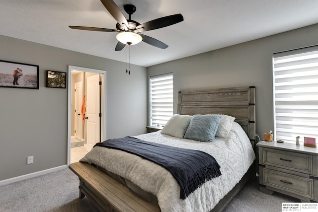 bedroom featuring connected bathroom, carpet, baseboards, and ceiling fan