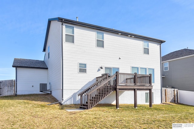 rear view of property with stairs, central air condition unit, a lawn, and fence