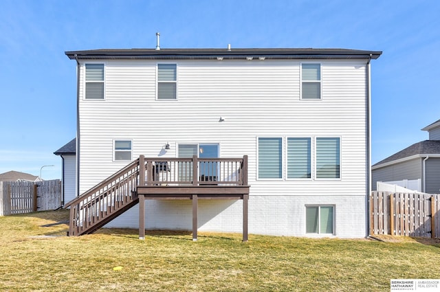 rear view of property featuring a fenced backyard, a deck, stairs, and a yard