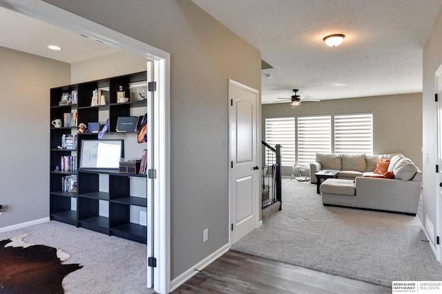 corridor featuring carpet and baseboards