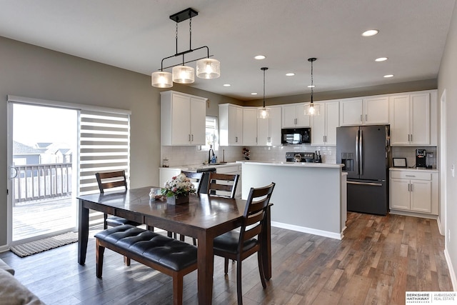 dining space featuring recessed lighting, wood finished floors, and visible vents