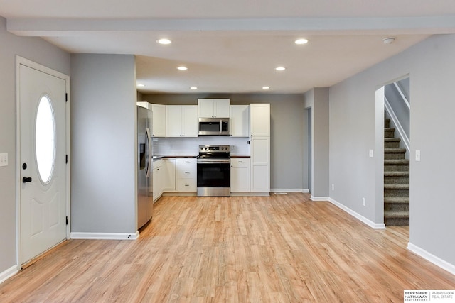 kitchen with visible vents, light wood-style flooring, recessed lighting, appliances with stainless steel finishes, and white cabinets