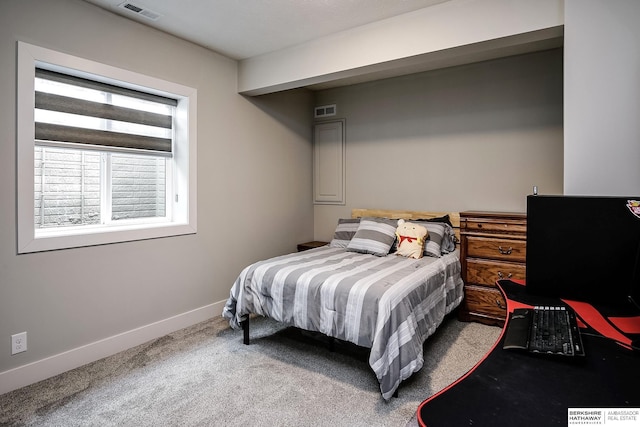 carpeted bedroom featuring visible vents and baseboards