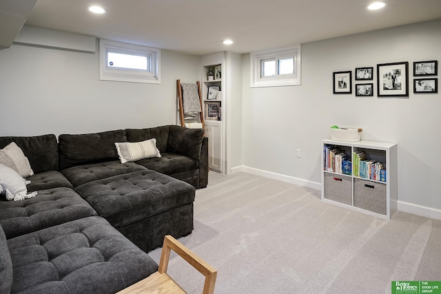 living room with light carpet, plenty of natural light, recessed lighting, and baseboards