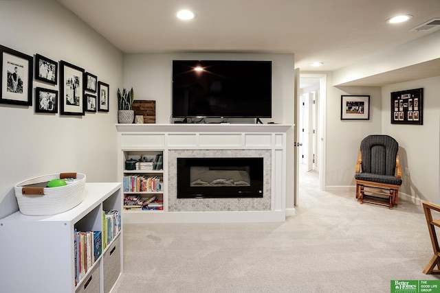 carpeted living area featuring recessed lighting, visible vents, and baseboards