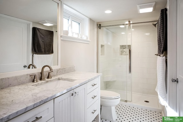 bathroom with visible vents, a stall shower, toilet, and vanity