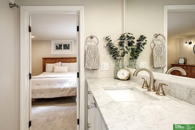 bathroom featuring ensuite bath and vanity