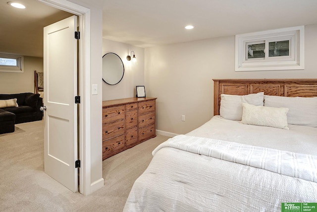 bedroom with recessed lighting, light colored carpet, and baseboards