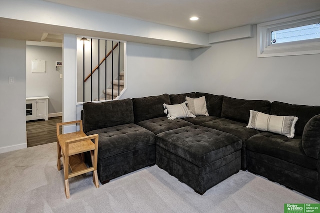 carpeted living room with recessed lighting, stairway, and baseboards