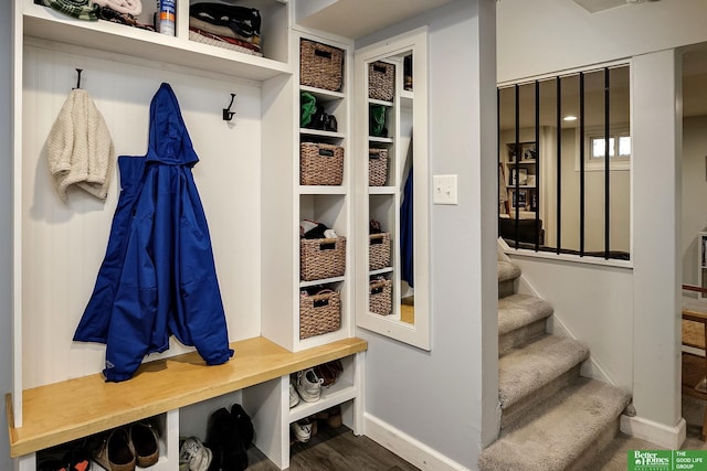 mudroom featuring baseboards and wood finished floors