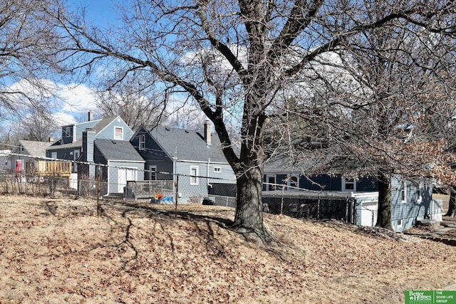 exterior space with a residential view and fence