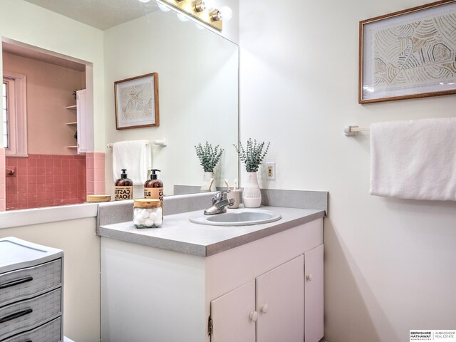 bathroom with backsplash and vanity