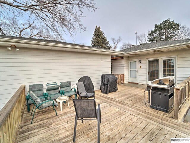 wooden deck with grilling area