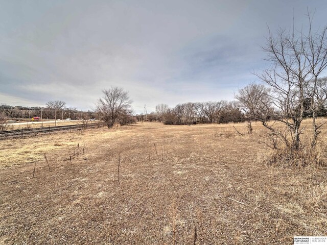 view of yard with a rural view