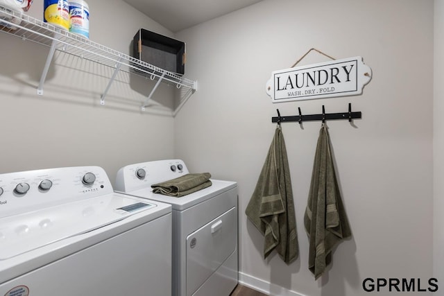 washroom featuring washing machine and dryer and laundry area