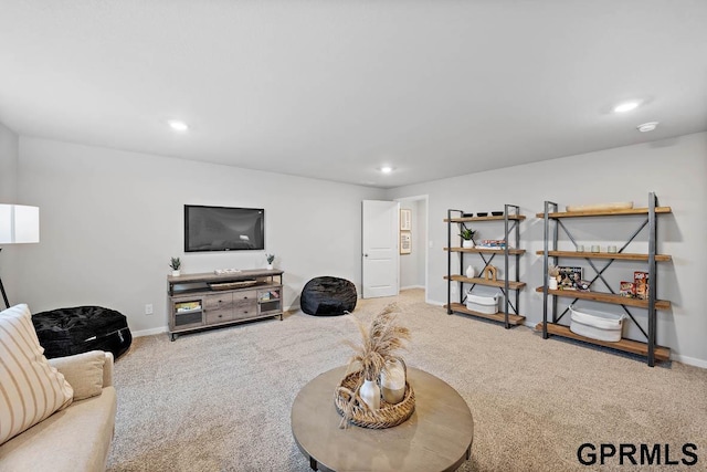 living room featuring recessed lighting, baseboards, and carpet