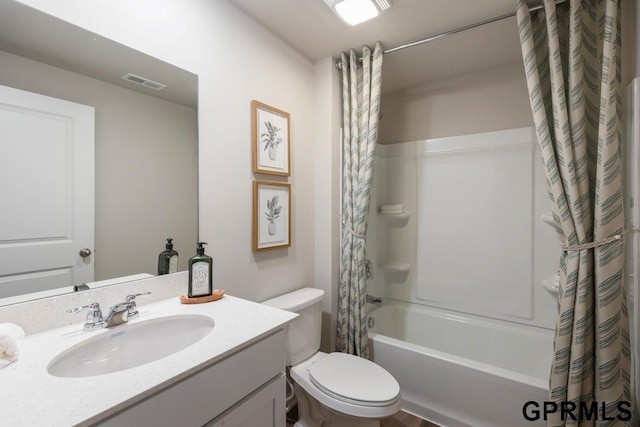 full bath featuring visible vents, toilet, vanity, and shower / tub combo