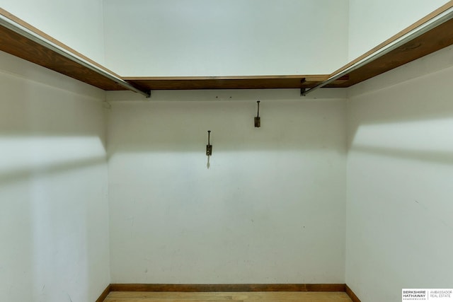 spacious closet featuring visible vents