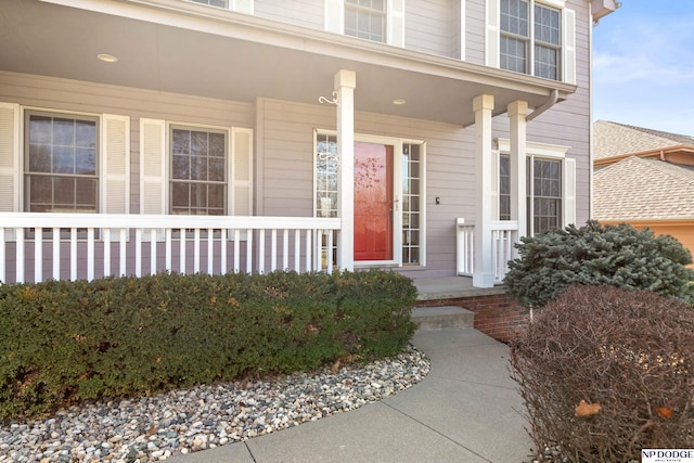 doorway to property featuring covered porch